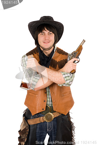 Image of Smiling cowboy with a bottle and gun