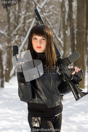 Image of young woman with weapon