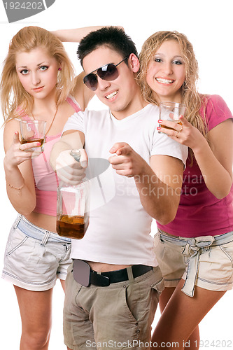 Image of Happy young people with a bottle of whiskey