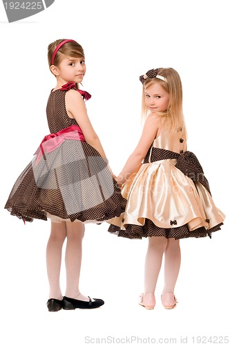 Image of Two little girls in a dress. Isolated