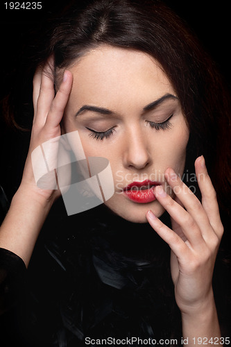 Image of young lady with closed eyes