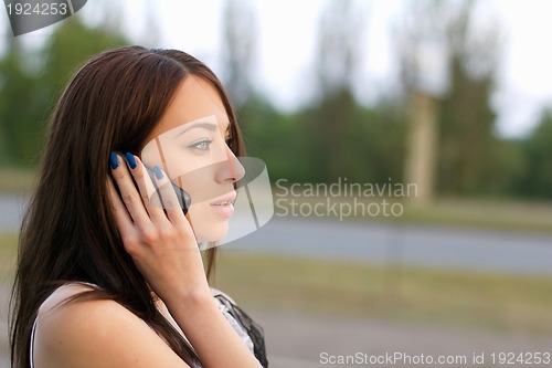 Image of woman talking on the phone