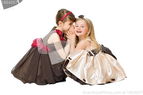 Image of Two little girls talking. Isolated