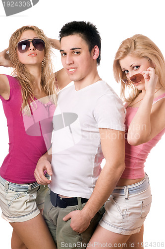 Image of two playful blonde women with handsome young man