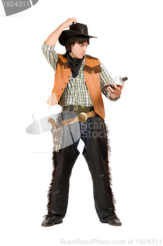 Image of Pensive young cowboy with a bottle