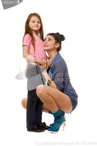 Image of Smiling young mother and little daughter. Isolated