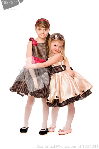 Image of Two cute little girls in a dress. Isolated