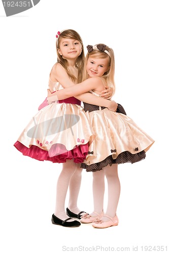 Image of Two happy little girls in a dress