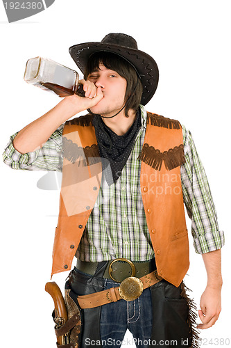 Image of Cowboy drinking whiskey