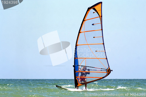 Image of windsurfer on the blue sea