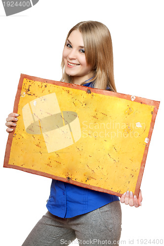 Image of Cheerful young woman posing with yellow vintage board