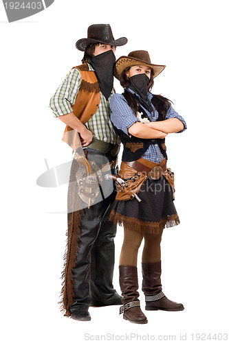 Image of Couple of burglars in cowboy costumes