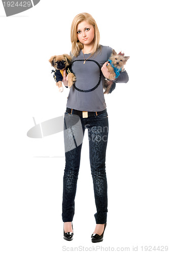 Image of Lovely young blonde posing with two dogs