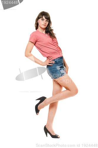 Image of Attractive girl in jeans mini skirt. Isolated