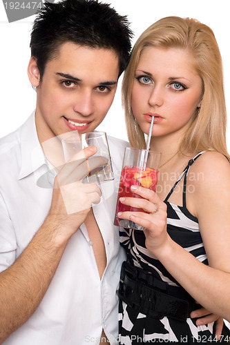 Image of Young couple with cocktails. Isolated