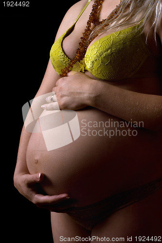 Image of Belly of a young pregnant woman. Isolated