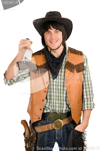 Image of happy young cowboy with a bottle