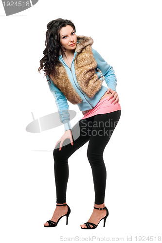 Image of Pretty brunette in a black leggings. Isolated