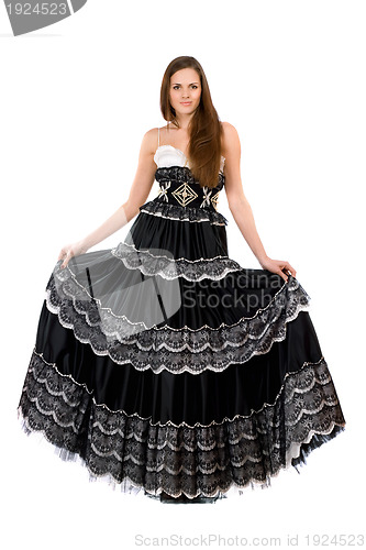 Image of Beautiful young woman in long dress
