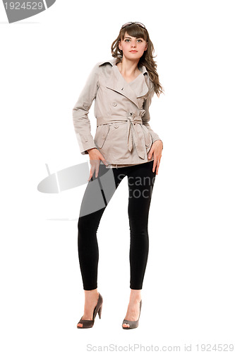 Image of Lovely girl wearing a coat and black leggings