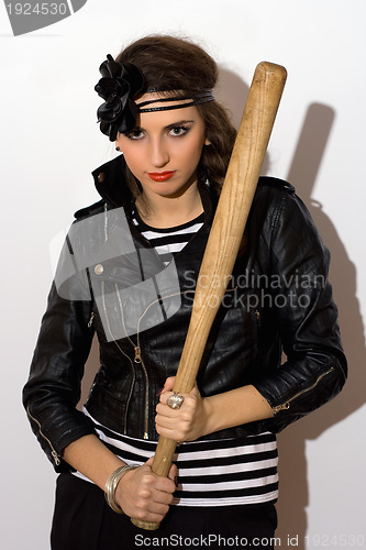 Image of Pretty young woman with a bat