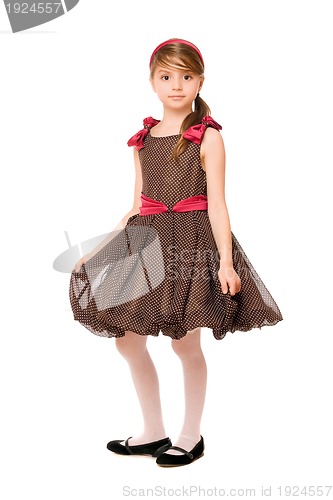 Image of Attractive little lady in a brown dress