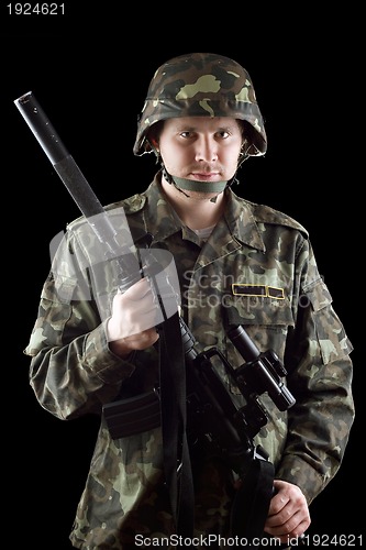 Image of Armed soldier grasping m16