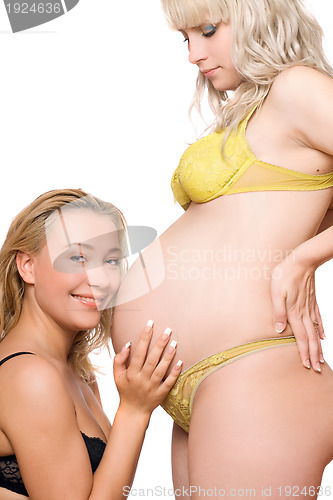 Image of Pregnant woman with the smiling girlfriend. Isolated