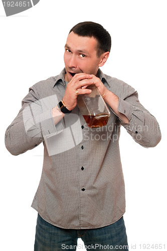 Image of Man opens a bottle of whiskey