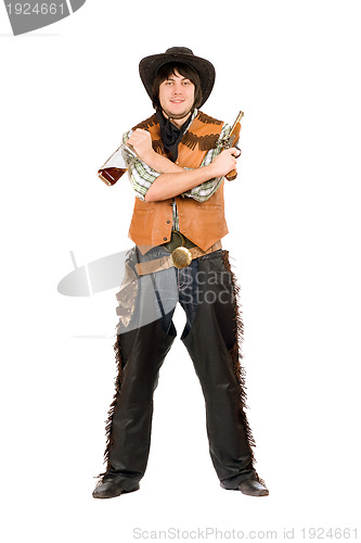 Image of Happy cowboy with a bottle and gun