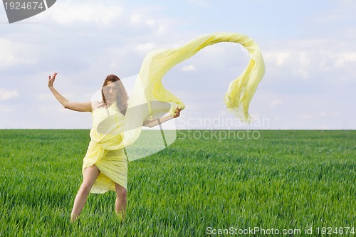 Image of Cute young woman dancing