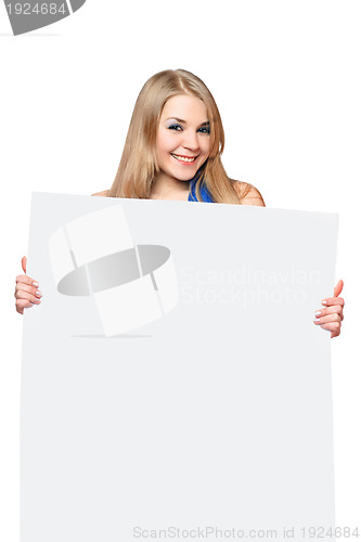 Image of Happy young woman posing with white board