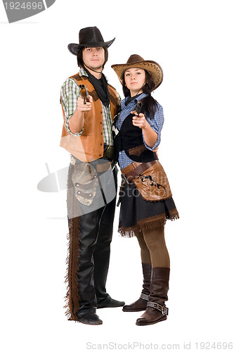 Image of Young cowboy and cowgirl with a guns