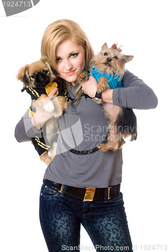 Image of Smiling blonde posing with two dogs