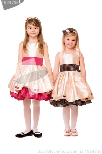 Image of Two charming little girls in a dress