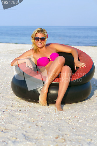 Image of Pretty girl sitting in an chair