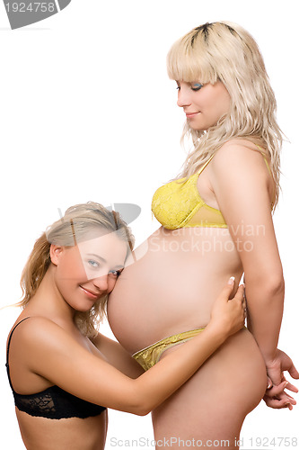 Image of Pregnant woman with the smiling girlfriend