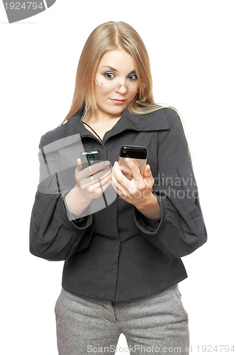Image of Portrait of surprised young blonde in a gray business suit