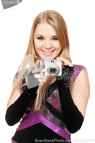 Image of Smiling blonde holding a photo camera. Isolated
