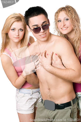 Image of Two playful blonde women with young man