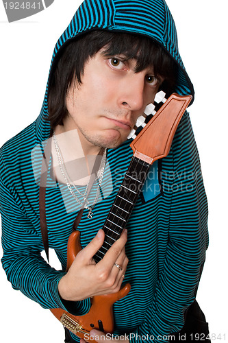 Image of Bizarre young man with a little guitar. Isolated