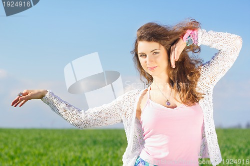 Image of Portrait of smiling lovely young woman