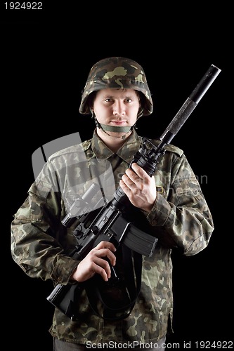 Image of Soldier staying with m16