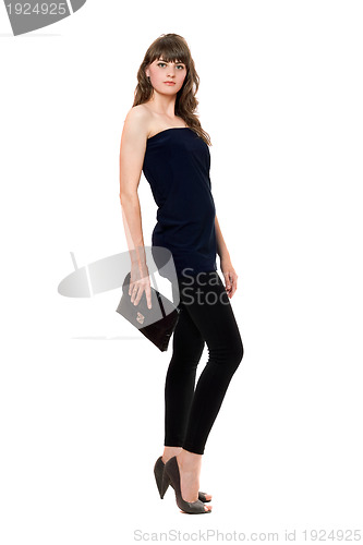 Image of Beautiful girl in black leggings with a handbag