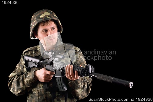 Image of Arming soldier and a rifle