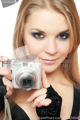 Image of Young beautiful woman holding a photo camera