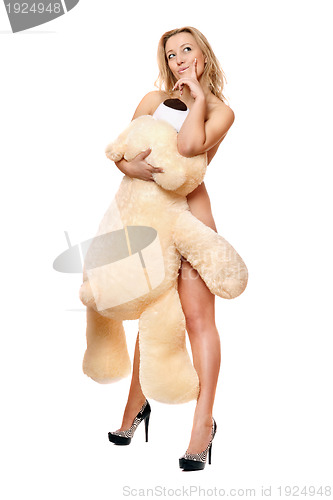 Image of woman posing with large teddy bear