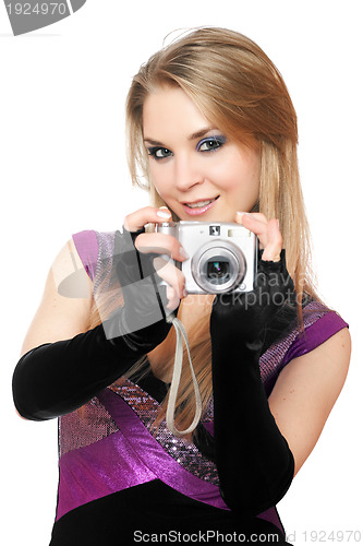 Image of Playful blonde holding a photo camera. Isolated