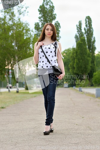 Image of Perfect young woman walking