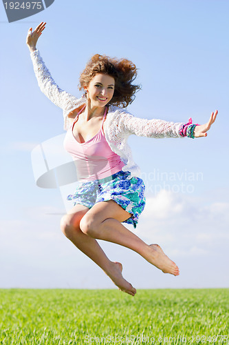 Image of Joyful beautiful young woman